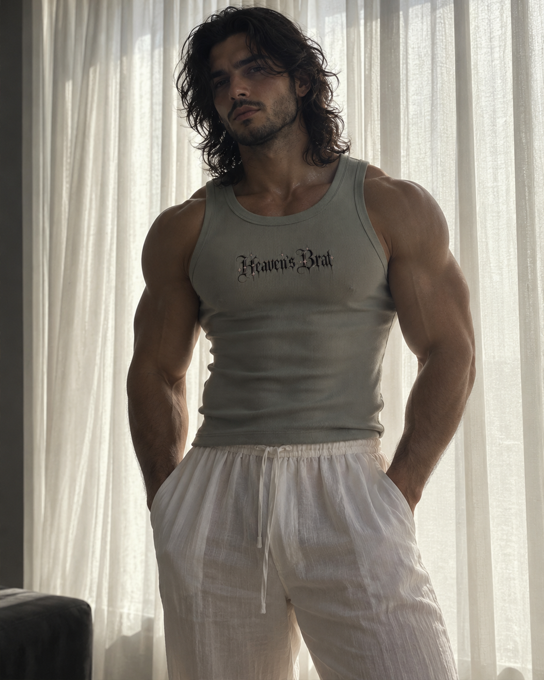 A muscular man with long dark hair stands in front of sheer white curtains, wearing a fitted light gray tank top with 'Franco's Bar' printed in black gothic lettering across the chest, paired with white drawstring shorts.

Color: Storm Front